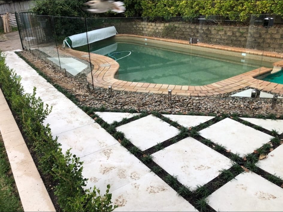 Completed Artarmon poolside landscaping with new paving and planted garden beds